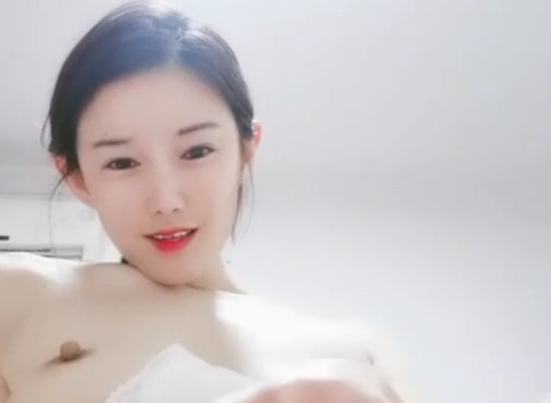 Beautiful young woman takes selfies and touches her acupoints madou